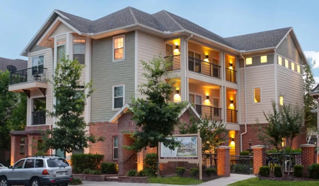 Apartment building with balconies and lights exterior at Ashton Lane Luxury Apartments in Gainesville Student Accommodation