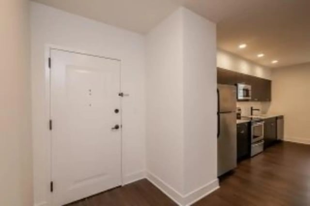 White door and stainless steel appliances kitchen at Cooper Village in Camden Student Accommodation