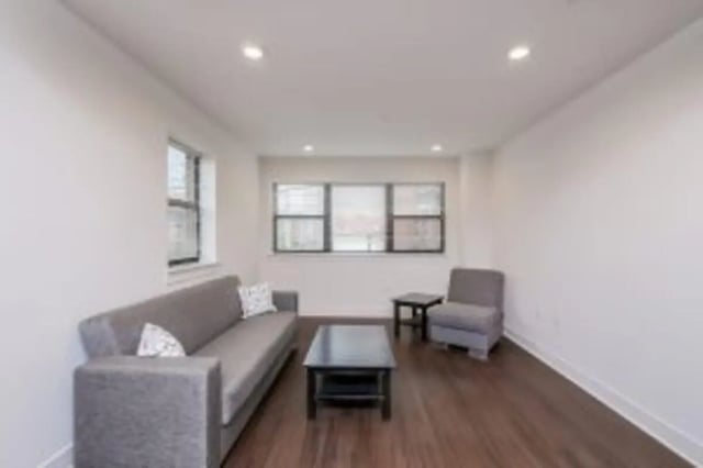 Sofa chair and tables in a living room at Cooper Village in Camden Student Accommodation