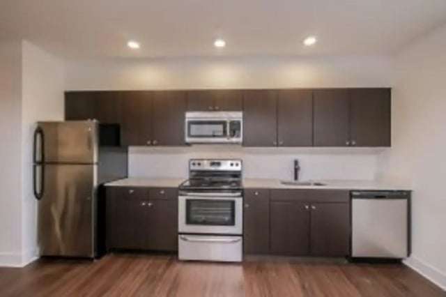 Stainless steel refrigerator stove microwave dishwasher kitchen at Cooper Village in Camden Student Accommodation