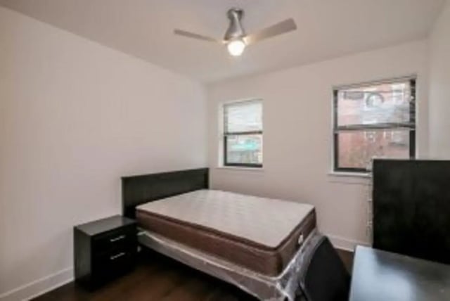 Bed nightstand and ceiling fan bedroom at Cooper Village in Camden Student Accommodation