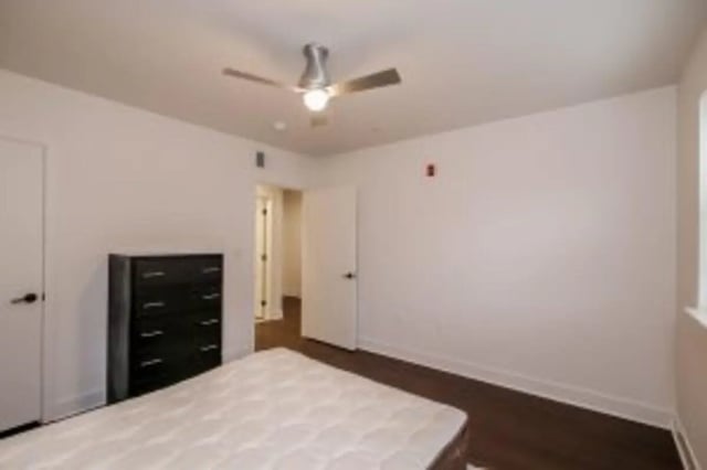 Dresser ceiling fan white mattress bedroom at Cooper Village in Camden Student Accommodation