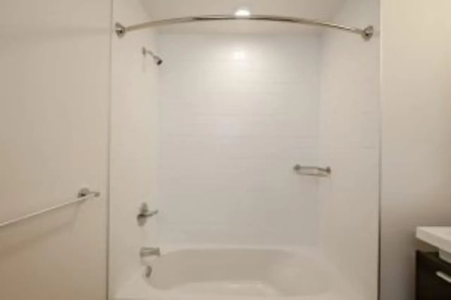 White bathtub shower fixtures and towel bar bathroom at Cooper Village in Camden Student Accommodation