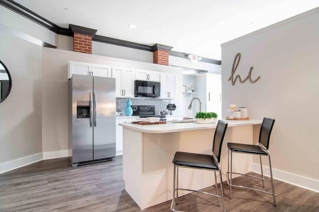Modern kitchen with island and bar stools kitchen at The Flats At Carrs Hill in Athens Student Accommodation