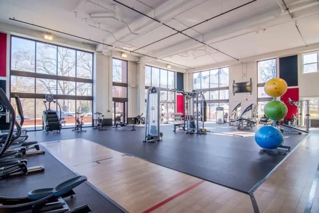Gym equipment weights balls and large windows gym at The Flats At Carrs Hill in Athens Student Accommodation