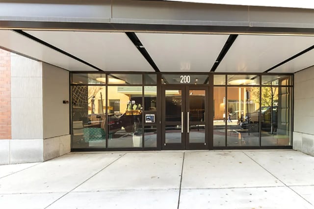 Glass entrance with number 200 exterior at College and Crown Apartments in New Haven Student Accommodation