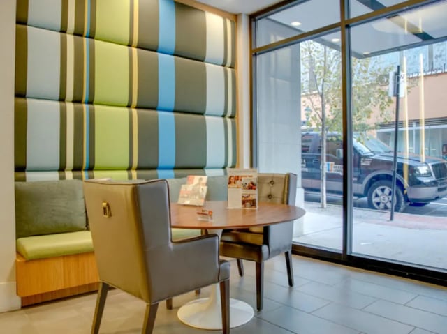 Seating and table with view outside exterior at College and Crown Apartments in New Haven Student Accommodation