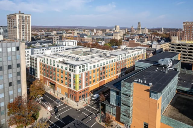 Colorful apartment building with city view exterior at College and Crown Apartments in New Haven Student Accommodation