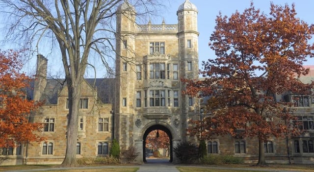 Stone building with arch and autumn trees Exterior at Sterling Arbor Blu in Ann Arbor Student Accommodation