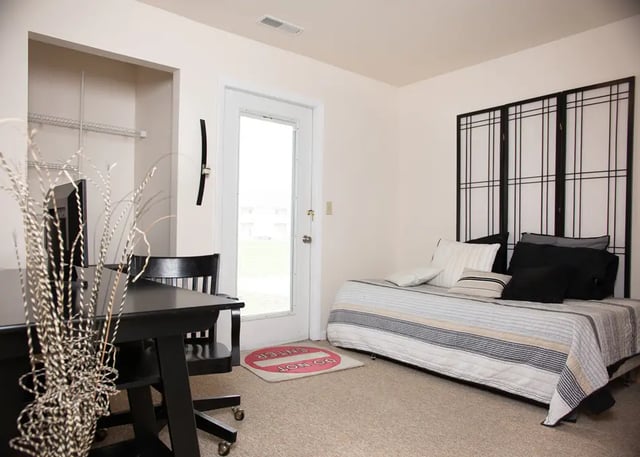 Desk daybed with Japanese screen bedroom at Campus Communities - College Town Apartments in Big Rapids Student Accommodation