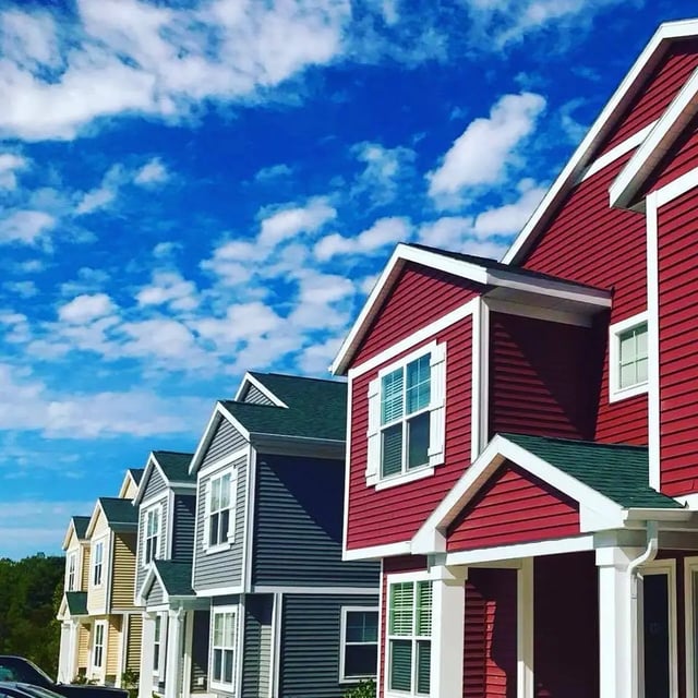 Colorful townhouses with windows and roofs exterior at Campus Communities- Campus Creek Townhomes in Big Rapids Student Accommodation
