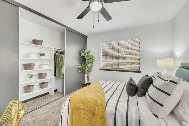 Shelving baskets clothes bed lamp window bedroom at The Timbers in San Marcos Student Accommodation
