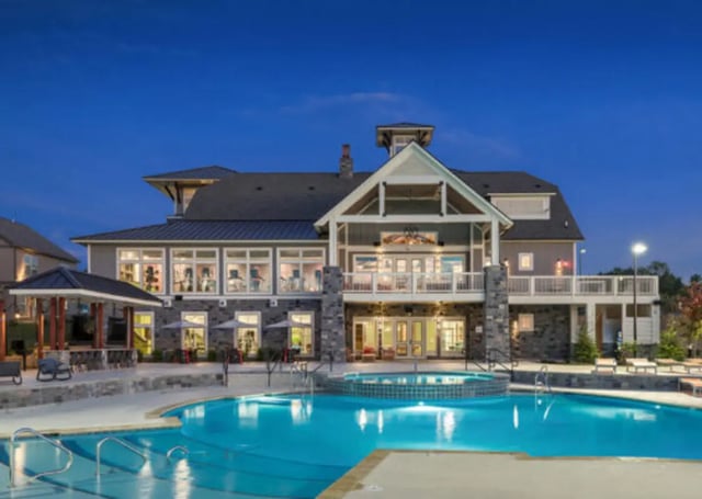Apartment building with pool and outdoor seating Exterior at Brexx at Blacksburg in Blacksburg Student Accommodation