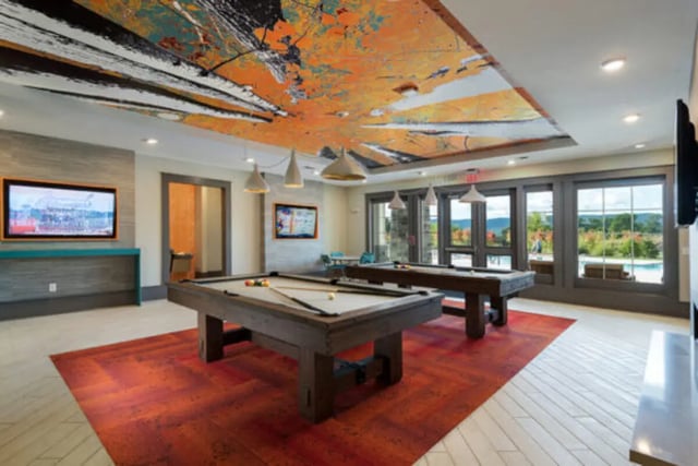 Pool tables on red rug and tiled floor lounge at Brexx at Blacksburg in Blacksburg Student Accommodation