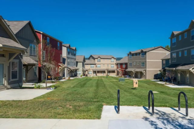 Townhouses around a grassy courtyard exterior at Brexx at Blacksburg in Blacksburg Student Accommodation