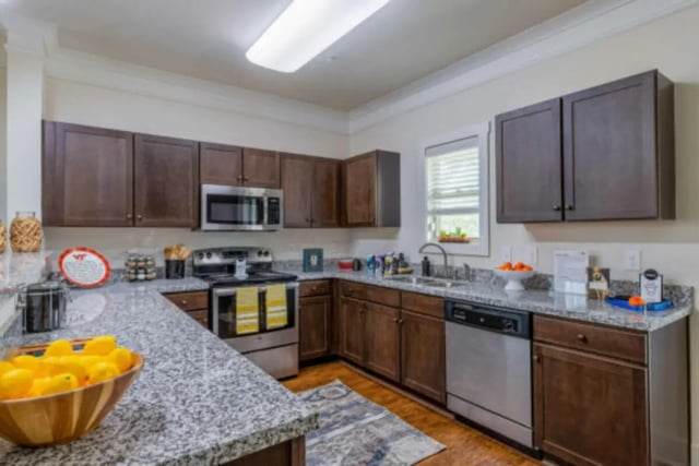 Kitchen with stainless steel appliances and dark cabinets kitchen at Brexx at Blacksburg in Blacksburg Student Accommodation