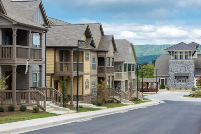 Townhouses with balconies and a stone tower exterior at Brexx at Blacksburg in Blacksburg Student Accommodation
