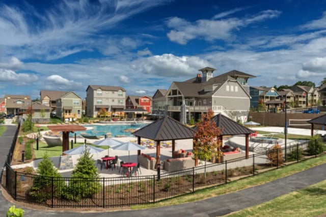 Outdoor pool seating and resort buildings exterior at Brexx at Blacksburg in Blacksburg Student Accommodation