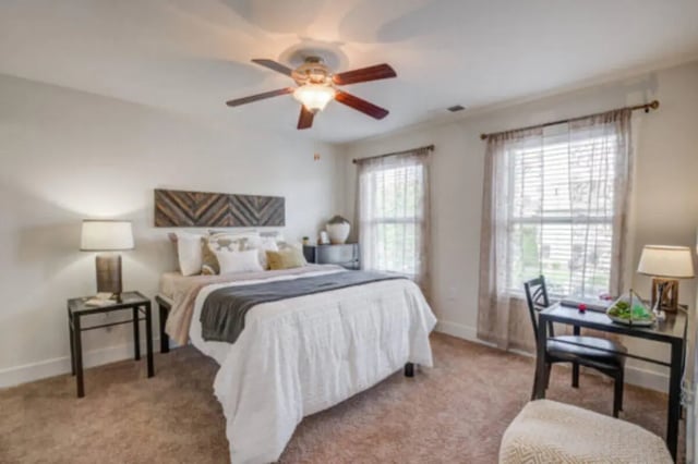 Bed nightstand desk lamp carpet bedroom at Brexx at Louisville in Louisville Student Accommodation