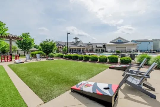 Cornhole boards chairs on grass exterior at Brexx at Louisville in Louisville Student Accommodation