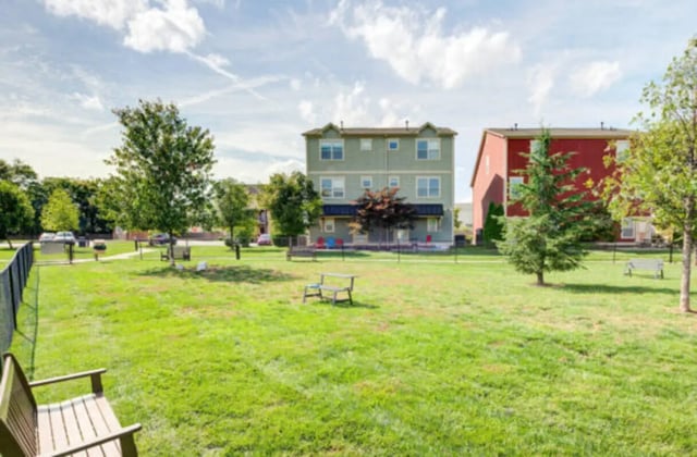 Apartment buildings with grassy yard and benches exterior at Brexx at Louisville in Louisville Student Accommodation