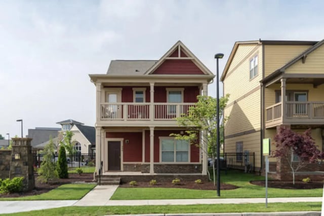 Two story red house with balconies exterior at Brexx at Louisville in Louisville Student Accommodation
