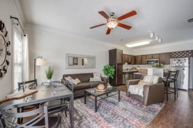 Dining table couch kitchen open plan living room at Brexx at Louisville in Louisville Student Accommodation