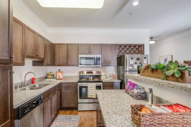Granite counters, dark cabinets, stainless steel appliances kitchen at Brexx at Louisville in Louisville Student Accommodation