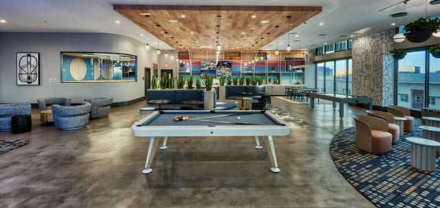 Pool table with balls seating and tables lounge area at Canvas in Tempe Student Accommodation