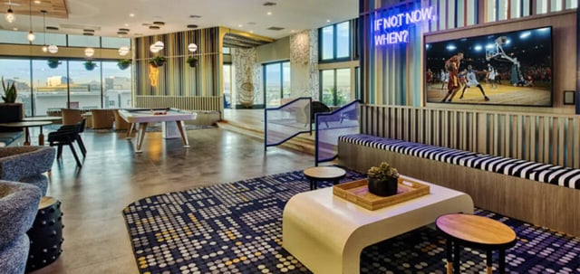 Pool table lounge area with large screen living room at Canvas in Tempe Student Accommodation