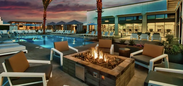 Fire pit chairs pool and gym exterior at Canvas in Tempe Student Accommodation