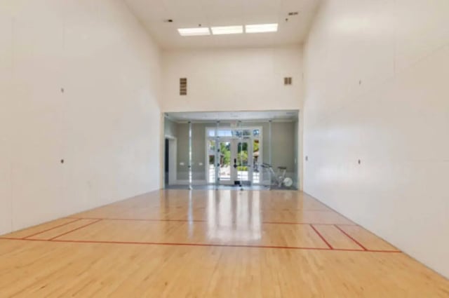 Hardwood court with glass walls and exercise equipment Recreation area at Brexx at State College in State College Student Accommodation