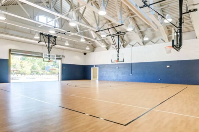 Gym with basketball hoops and court playing area at Brexx at State College in State College Student Accommodation