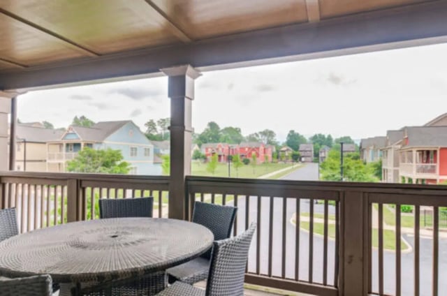 Wicker table and chairs on balcony exterior at Brexx at State College in State College Student Accommodation