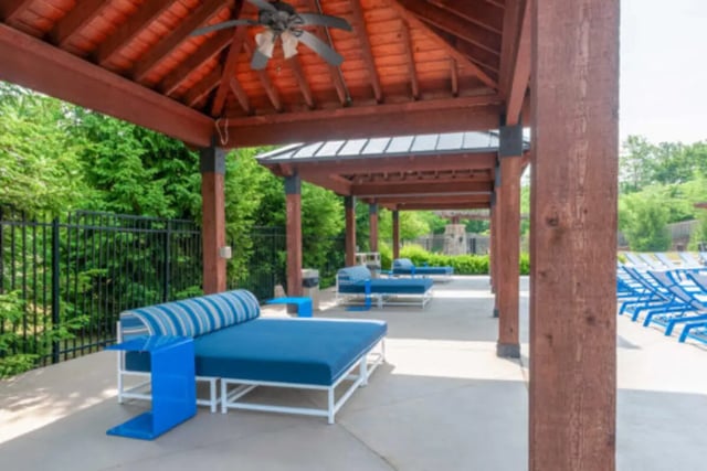 Blue lounge chairs under wooden pavilion playing area at Brexx at State College in State College Student Accommodation