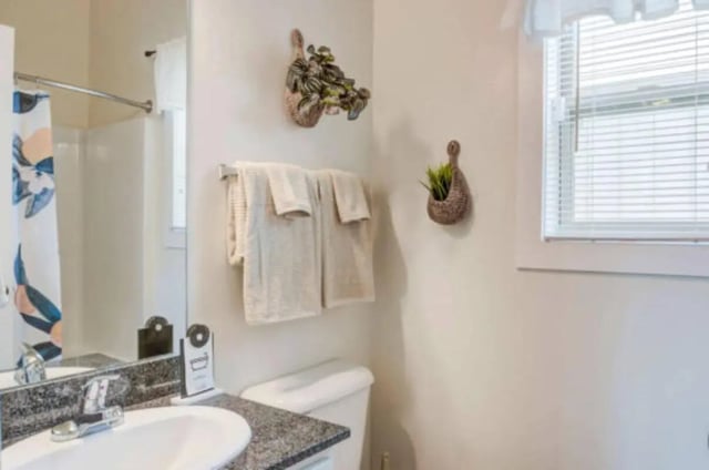 Toilet towels plants shower curtain sink bathroom at Brexx at State College in State College Student Accommodation