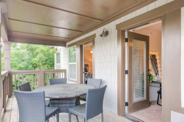 Table and chairs on covered deck exterior at Brexx at State College in State College Student Accommodation
