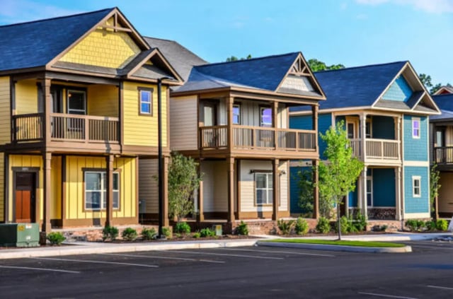 Colorful townhouses with balconies and windows exterior at Brexx at State College in State College Student Accommodation