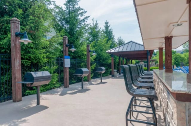 BBQ grills and bar stools outdoor kitchen at Brexx at State College in State College Student Accommodation