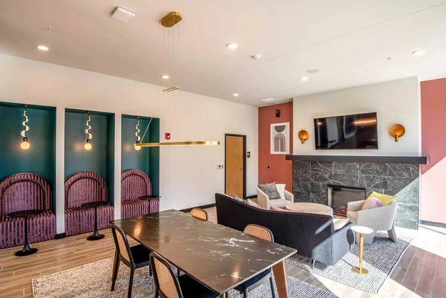 Marble dining table black chairs sofas living room at Ascend RVA in Richmond Student Accommodation