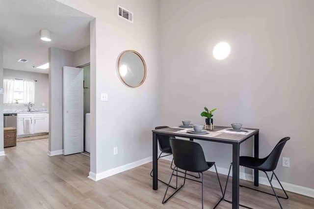 Dining table with chairs and kitchen view Dining area at The Townhomes At River Club in Athens Student Accommodation