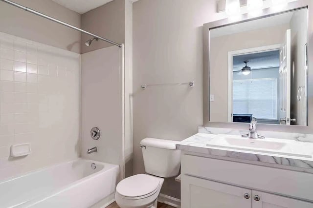 Bathtub toilet sink with vanity bathroom at The Townhomes At River Club in Athens Student Accommodation