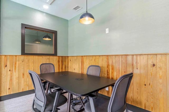 Four chairs around black table study area at The Townhomes At River Club in Athens Student Accommodation