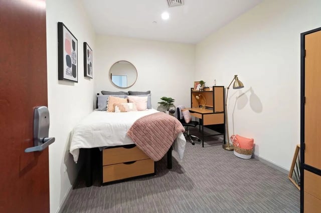 Bed desk and mirror student accommodation bedroom at The Printing House in Binghamton Student Accommodation