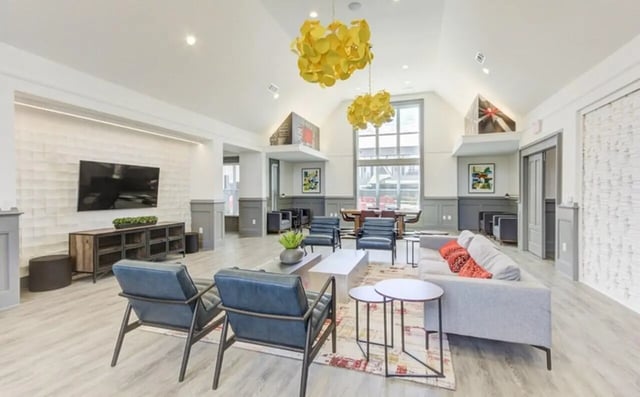 Modern lounge with sofa chairs tables living room at The Row At The Stadium in Columbia Student Accommodation