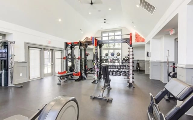 Weights racks machines and exercise equipment gym at The Row At The Stadium in Columbia Student Accommodation