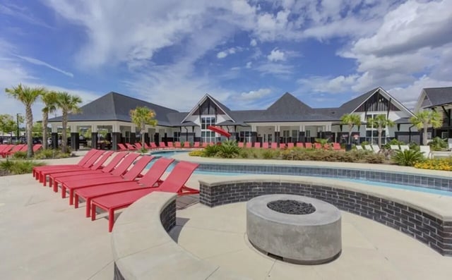Poolside loungers and fire pit exterior at The Row At The Stadium in Columbia Student Accommodation