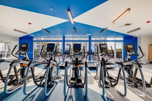 Elliptical machines and treadmills gym workout area at The Crossings Apartments in Sacramento Student Accommodation