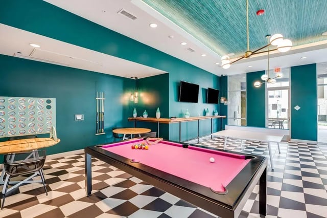 Pool table ping pong table TVs game wall recreation area at The Crossings Apartments in Sacramento Student Accommodation