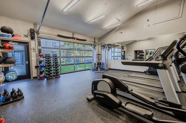 Treadmills elliptical weights rack gym exterior at Collegiate Suites in Blacksburg Student Accommodation